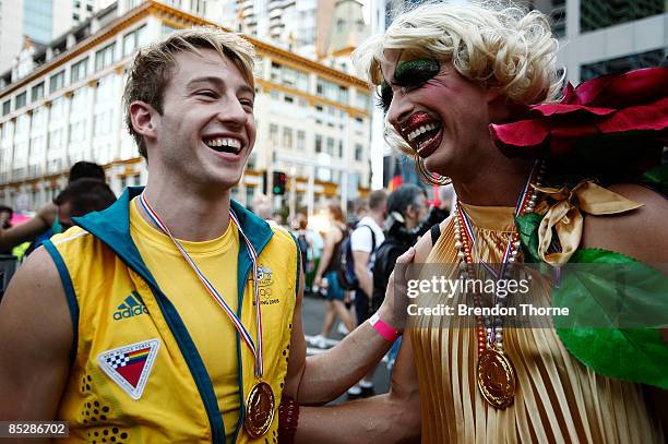 Australian Olympic gold medal winning diver Matthew Mitcham shares a joke with Joyce Maynge during the annual Sydney Gay and Lesbian Mardi Gras...