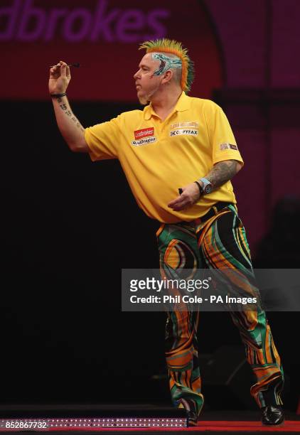 Peter Wright in action against Michael Smith during the third round match,during day twelve of The Ladbrokes World Darts Championship at Alexandra...
