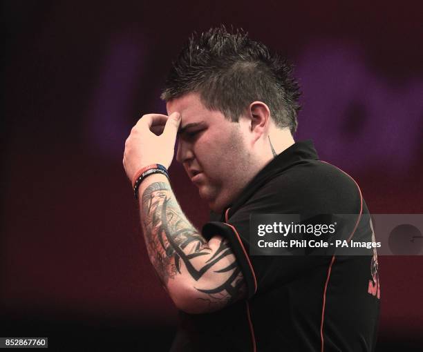 Michael Smith on missing a shot against Peter Wright during the third round match during day twelve of The Ladbrokes World Darts Championship at...