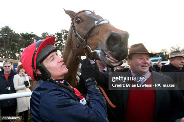 Barry Geraghty and trainer Nicky Henderson with Bobs Worth after winning the Lexus Steeplechase during day three of the Leopardstown Christmas...