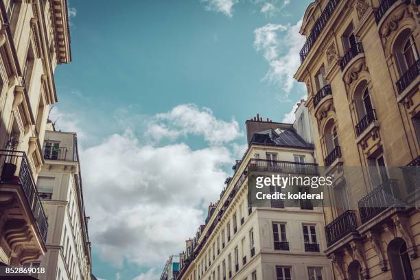 parisian historic buildings - paris street stock-fotos und bilder