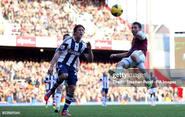 West Ham United's Razvan Rat and West Bromwich Albions' Billy Jones compete for the ball during the Barclays Premier League match at Upton Park,...