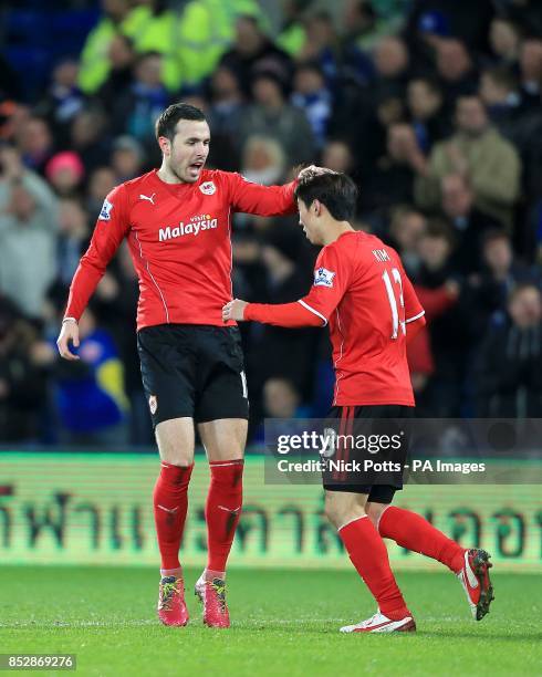 Cardiff City's Jordon Mutch celebrates with his team-mate Bo-Kyung Kim after scoring his team's opening goal
