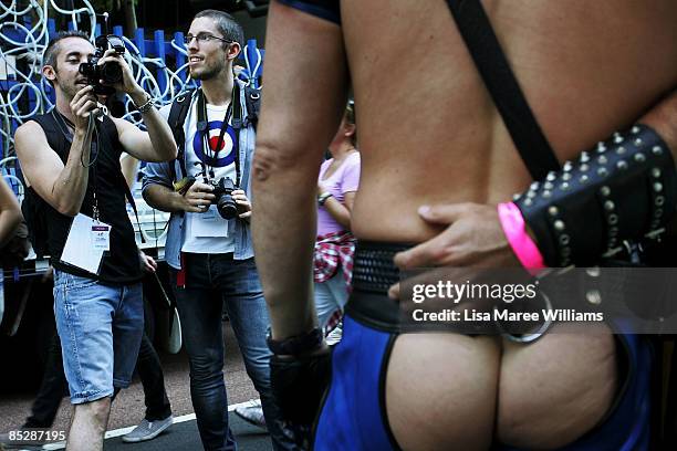 Parade goers take photos of each other during the annual Sydney Gay and Lesbian Mardi Gras Parade on Oxford Street on March 7, 2009 in Sydney,...