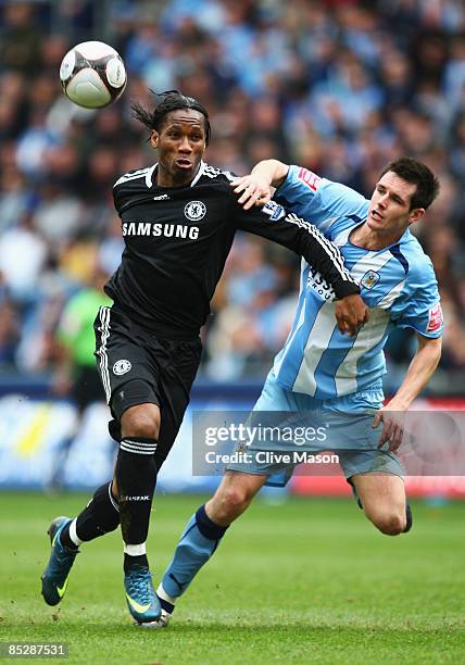 Didier Drogba of Chelsea tangles with Scott Dann of Coventry City during the FA Cup Sponsored by E.ON 6th round match between Coventry City and...