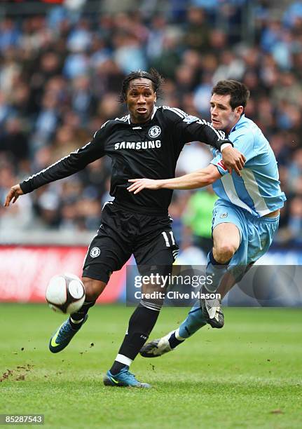 Didier Drogba of Chelsea tangles with Scott Dann of Coventry City during the FA Cup Sponsored by E.ON 6th round match between Coventry City and...