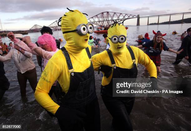 Swimmers take part in the loony dook New Year's Day dip in the Firth of Forth at South Queensferry, as part of Edinburgh's three-day-long Hogmanay...
