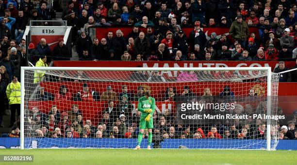 Manchester United's goalkeeper David De Gea appears dejected after Tottenham Hotspur's Christian Eriksen scored his team's second goal