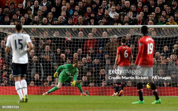 Manchester United's goalkeeper David De Gea watches as a header from Tottenham Hotspur's Emmanuel Adebayor goes into the net for their opening goal
