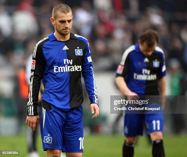 Mladen Petric of Hamburg and Ivica Olic of Hamburg looks dejected after losing 1-4 the Bundesliga match between Borussia Moenchengladbach and...