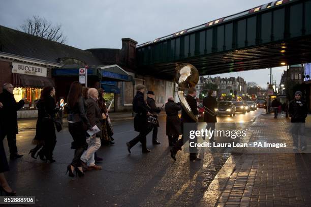 Band leads mourners to the wake after the funeral of Ronnie Biggs at Golders Green Crematorium, north London.