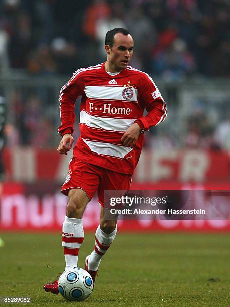 Landon Donovan of Muenchen runs with the ball in his last match for Bayern Munich during the Bundesliga match between FC Bayern Muenchen and Hannover...