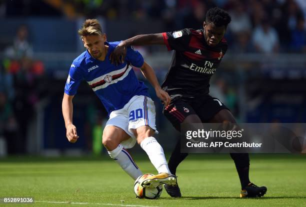 Sampdoria'su Uuguayan midfielder Gaston Ramirez vies with AC Milan's Ivorian midfielder Franck Kessie during the Italian Serie A football match...