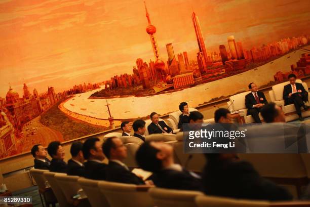 Shanghai mayor Han Zheng communist party secretary of Shanghai Yu Zhengsheng and delegates discuss how to tackle the global economic crisis during a...