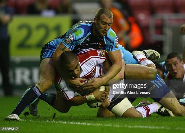 Thomas Leuluai of Wigan Warriors is tackled just short of the try line by Michael Platt of Bradford Bulls during the the engage Super League match...