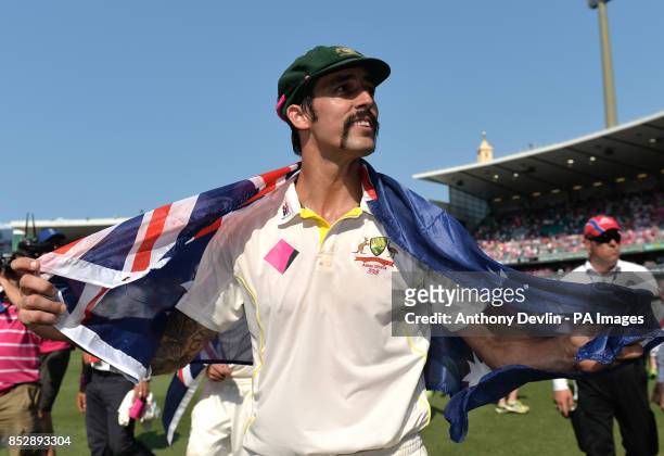 Australia's Mitchell Johnson celebrates as Australia players do a lap of honour during day three of the Fifth Test at the Sydney Cricket Ground,...