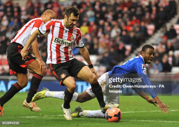 Carlisle's David Amoo trys to claim a penalty after a tackle in the box by Sunderland's Andrea Dossena during the FA Cup Third Round match at The...