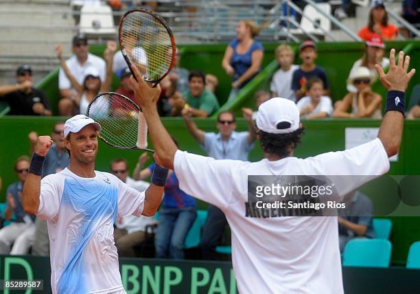 Argentina's tennis players Lucas Arnold and Martin Vasallo Arguello celebrate after winning the double match against Netherland's tennis players...