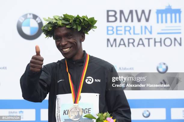 Eliud Kipchoge of Kenya celebrates at the victory ceremony winning the BMW Berlin Marathon 2017 on September 24, 2017 in Berlin, Germany.