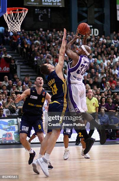 Clif Brown of Goettingen and Adam Chubb of Berlin battle for the ball during the Basketball Bundesliga match between MEG Goettingen and Alba Berlin...