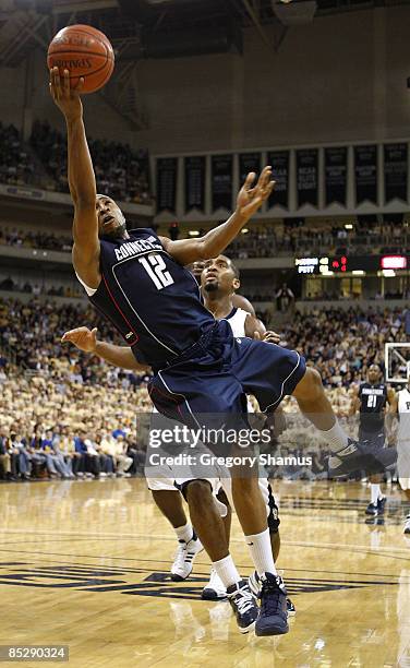 Price of the Connecticut Huskies gets a shot off in front of Brad Wanamaker of the Pittsburgh Panthers on March 7, 2009 at the Petersen Events Center...
