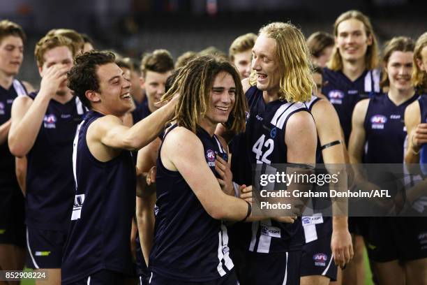 Gryan Miers of the Geelong Falcons is congratulated by teammates after winning best on ground during the TAC Cup Grand Final match between Geelong...