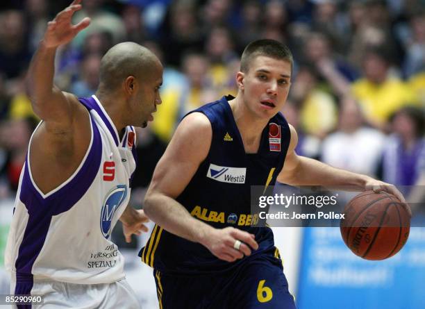 Steffen Hamann of Berlin and Kyle Bailey of Goettingen battle for the ball during the Basketball Bundesliga match between MEG Goettingen and Alba...