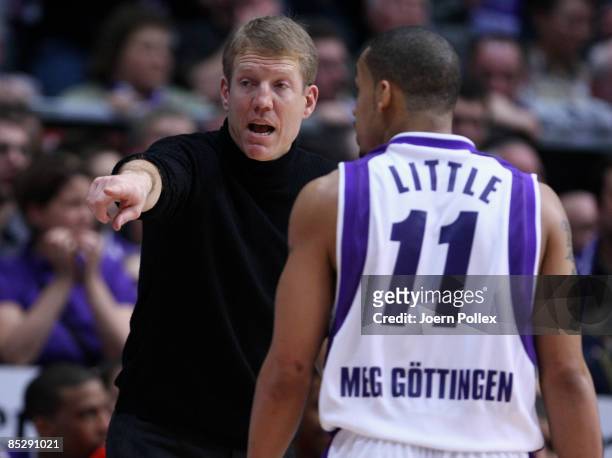 Head coach John Patrick of Goettingen talks to his player John Little during the Basketball Bundesliga match between MEG Goettingen and Alba Berlin...