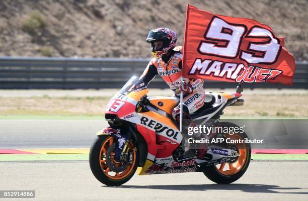 Repsol Honda Team's Spanish rider Marc Marquez celebrates on his bike winnig the MotoGP race of the Moto Grand Prix of Aragon at the Motorland...