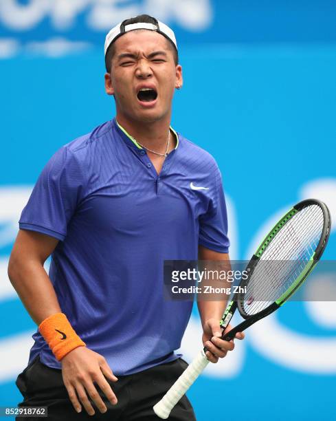 Zihao Xia of China reacts during the match against Mate Pavic of Croatia during Qualifying second round of 2017 ATP Chengdu Open at Sichuan...