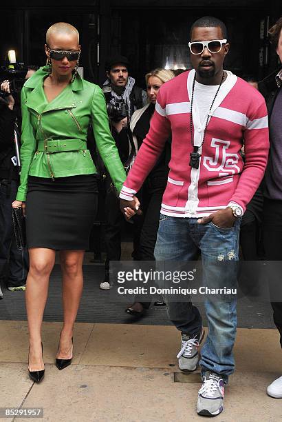 Kanye West and Amber Rose attend the Jeremy Scott Ready-to-Wear A/W 2009 fashion show during Paris Fashion Week at Faculte de Medecine on March 7,...