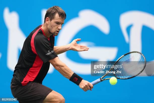 Marco Chiudinelli of Switzerland returns a shot during the match against Taylor Fritz of the United States during Qualifying second round of 2017 ATP...