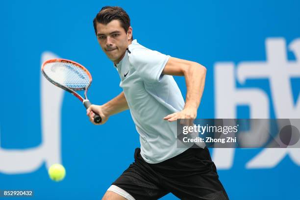 Taylor Fritz of the United States returns a shot during the match against Marco Chiudinelli of Switzerland during Qualifying second round of 2017 ATP...