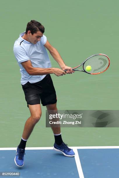 Taylor Fritz of the United States returns a shot during the match against Marco Chiudinelli of Switzerland during Qualifying second round of 2017 ATP...