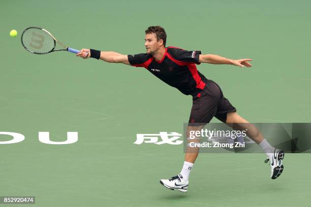 Marco Chiudinelli of Switzerland returns a shot during the match against Taylor Fritz of the United States during Qualifying second round of 2017 ATP...