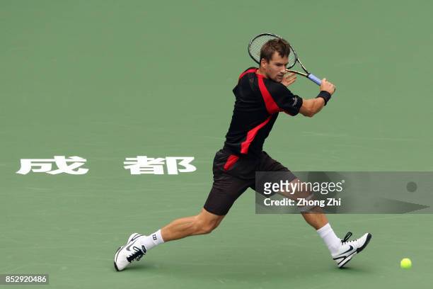 Marco Chiudinelli of Switzerland returns a shot during the match against Taylor Fritz of the United States during Qualifying second round of 2017 ATP...