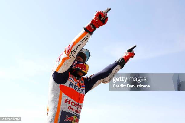 Marc Marquez of Spain and the Repsol Honda Team celebrates victory with his fans by the side of the track after the MotoGP of Aragon at Motorland...