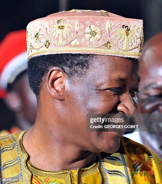 Burkina Faso president Blaise Compaoré leaves the pitch of the stadium after giving the Golden Stallion of Yennenga for best film at the Pan-African...