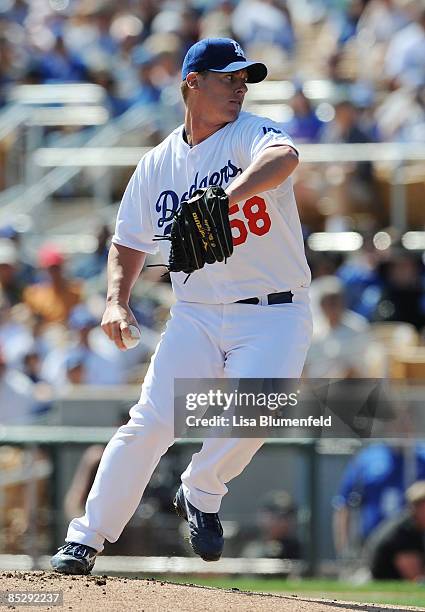 Chad Billingsley of the Los Angeles Dodgers pitches during a Spring Training game against the Seattle Mariners at Camelback Ranch on March 7, 2009 in...