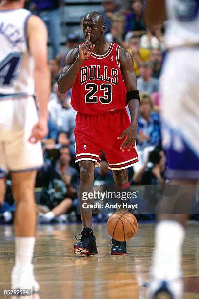 Michael Jordan of the Chicago Bulls moves the ball up court during Game Two of the 1998 NBA Finals against the Utah Jazz at the Delta Center June 5,...
