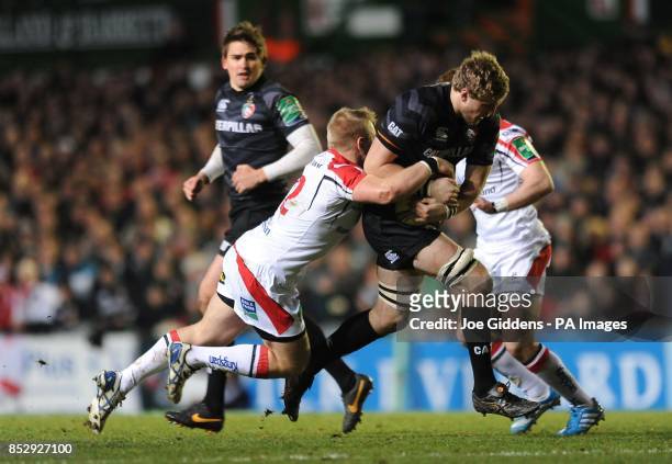 Leicester Tigers' Jamie Gibson is tackled by Ulster Rugby's Luke Marshall during the Heineken Cup, Pool Five at Welford Road, Leicester.