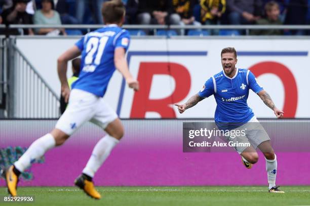 Tobias Kempe of Darmstadt celebrates his team's third goal during the Second Bundesliga match between SV Darmstadt 98 and SG Dynamo Dresden at...