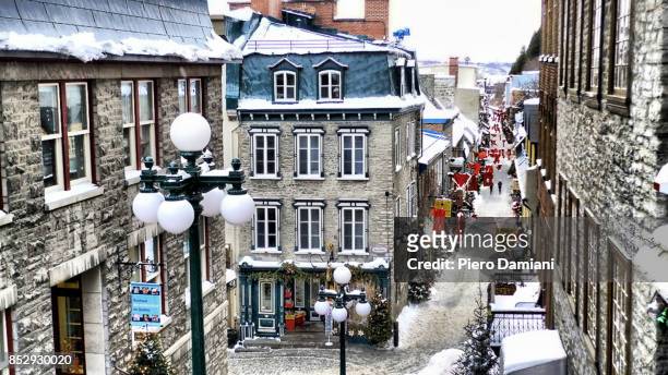 rue petit champlain on a snowy winter day - winter quebec stock pictures, royalty-free photos & images