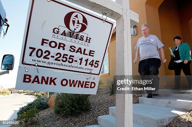 Jack Arnold of Nevada and RE/MAX Central realtor Mary Kennedy leave a bank-owned house during a tour of foreclosed homes March 7, 2009 in Las Vegas,...