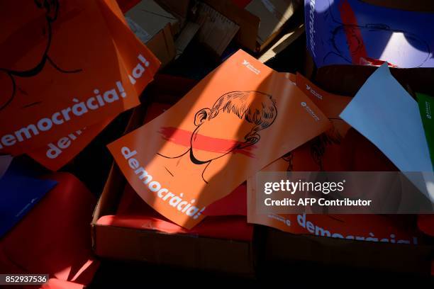 Picture taken on September 24, 2017 shows posters reading "Democracy" during a pro-referendum demonstration outside Barcelona's university in...