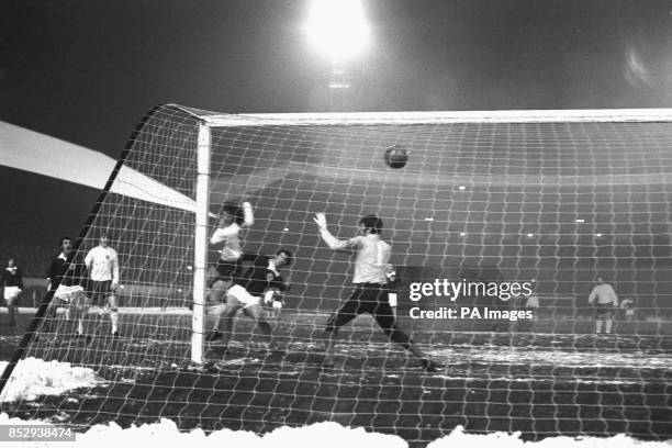 Mike Channon loops the ball past Scotland goalkeeper Bobby Clark to score England's thrid goal in the 15th minute of the Centenary international at...