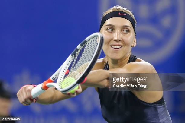 Elena Vesnina serves during the match against Duan Yingying on Day 1 of 2017 Dongfeng Motor Wuhan Open at Optics Valley International Tennis Center...
