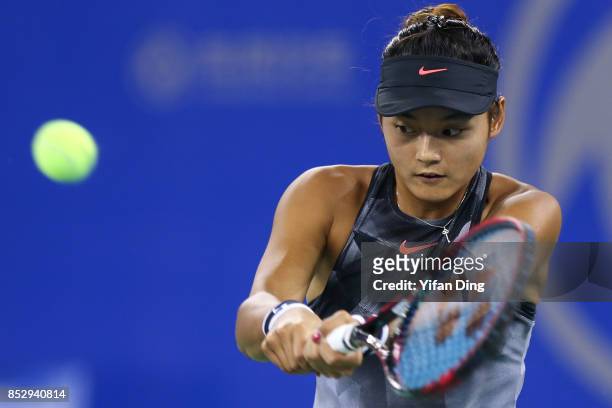 Wang Yafan plays a backhand during the match against Sorana Cirstea on Day 1 of 2017 Dongfeng Motor Wuhan Open at Optics Valley International Tennis...