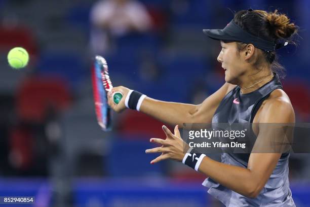 Wang Yafan plays a forehand during the match against Sorana Cirstea on Day 1 of 2017 Dongfeng Motor Wuhan Open at Optics Valley International Tennis...