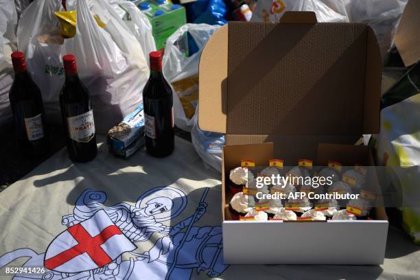 Picture taken on September 24, 2017 shows little Spanish flags on pastries that people brought to Barcelona's port with drink and food for Spanish...